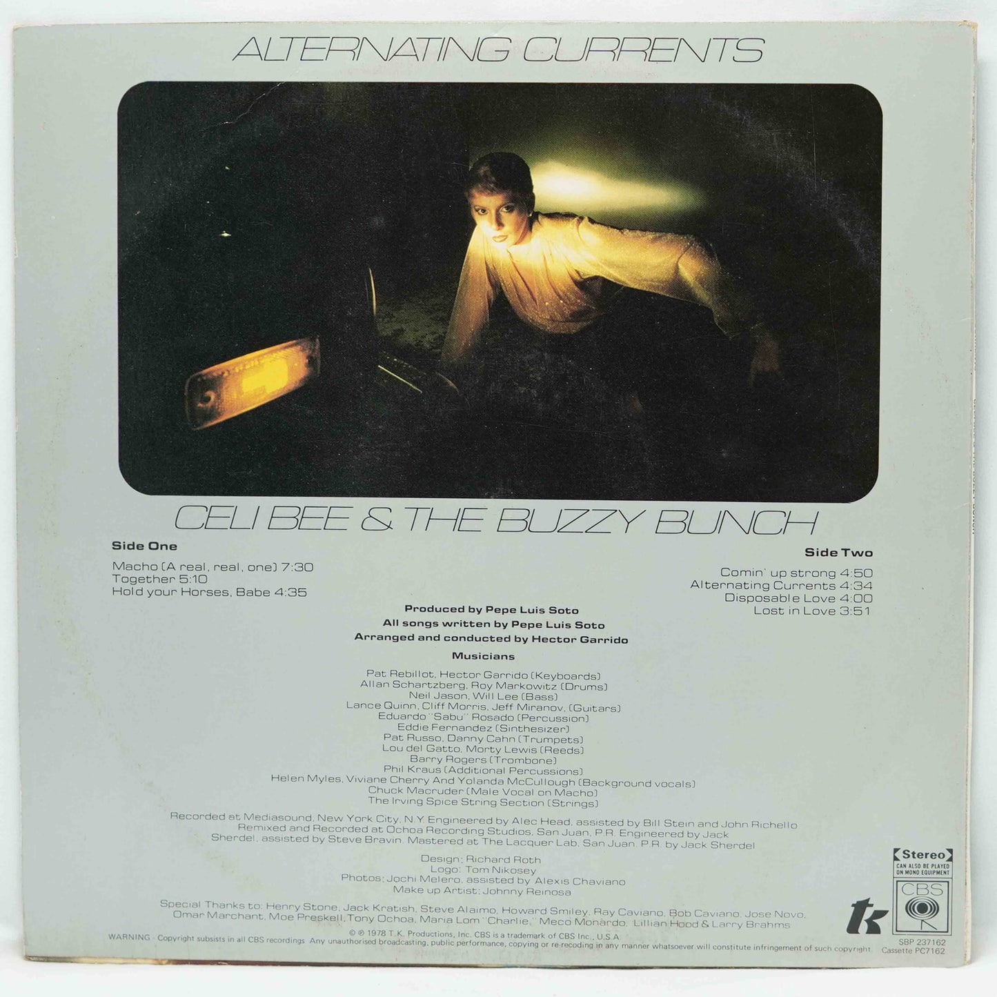 Album cover for 'Alternating Currents' by Cell Bee & The Buzzy Bunch with a person holding a guitar.